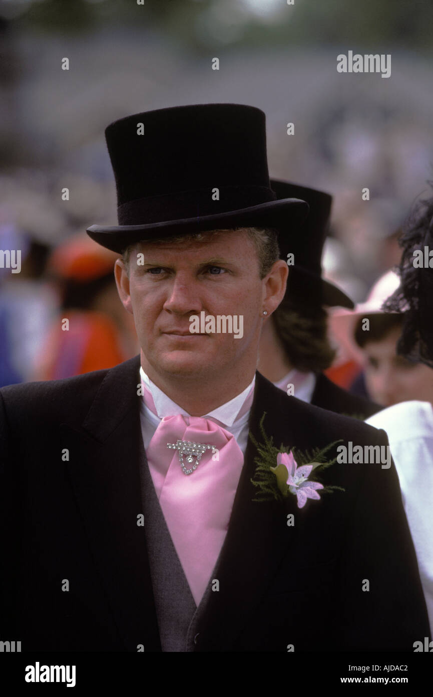 Dandy wearing black silk top hat black morning suit set off with a pink cravat and diamond cravat pin and pink button hole. Pink style LGBT 1990s UK Stock Photo