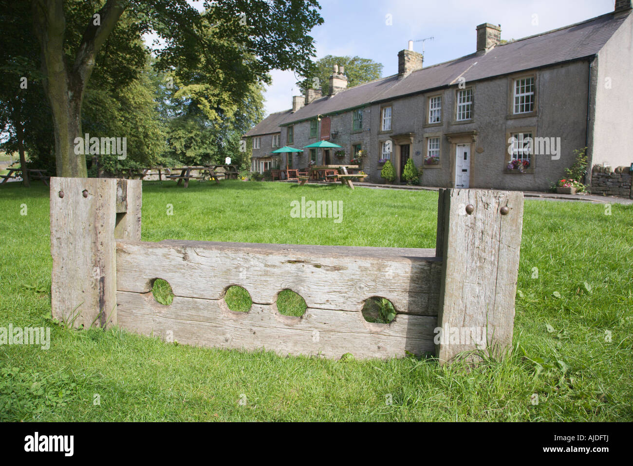 Stocks outside the Red Lion public house Litton Derbyshire in the Peak District National Park Stock Photo