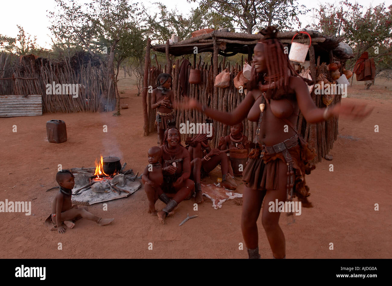 Namibia Kaokoland Himba people Himba woman covered in Ochre and clay otjize pulverized iron oxide mixed with butter fat danc Stock Photo