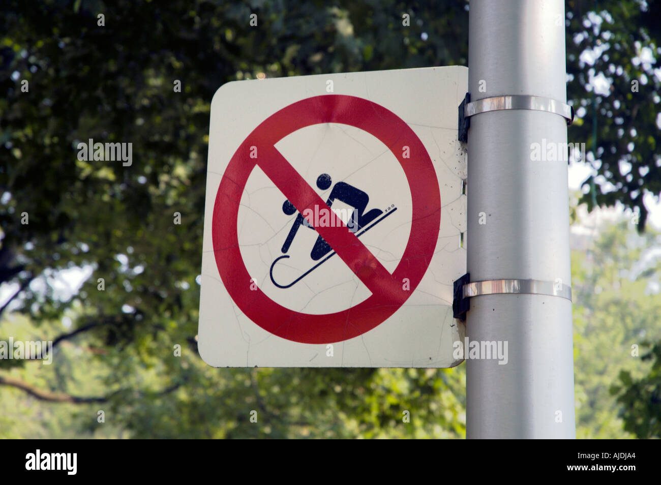 A restriction sign about slide in a park Lafontaine park Montreal Quebec Canada Stock Photo
