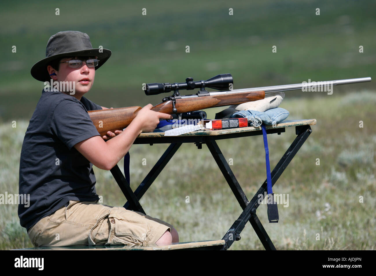 Teenage praire dog hunter with his rifle Stock Photo Alamy