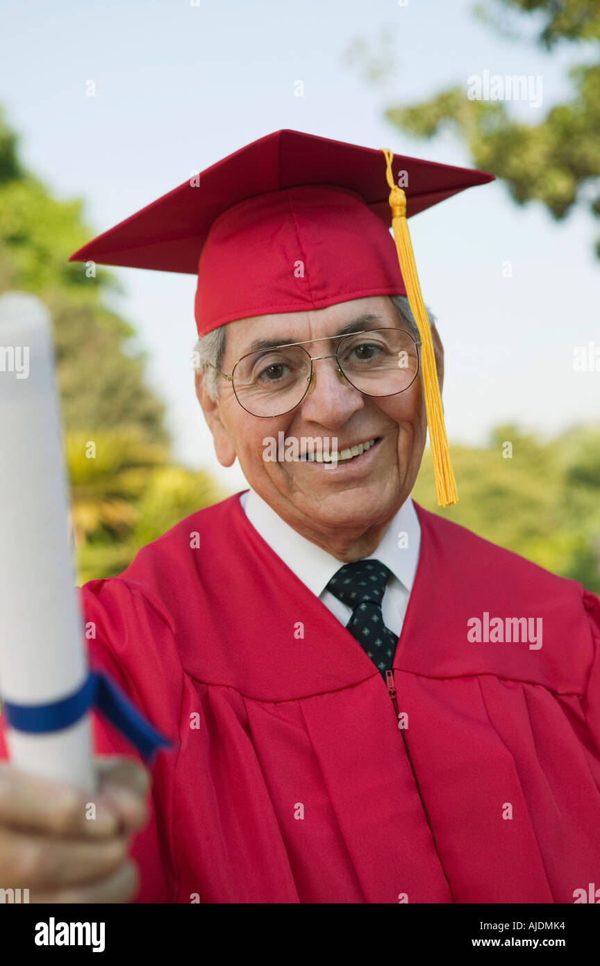 Senior graduate holding diploma outside hi-res stock photography and ...