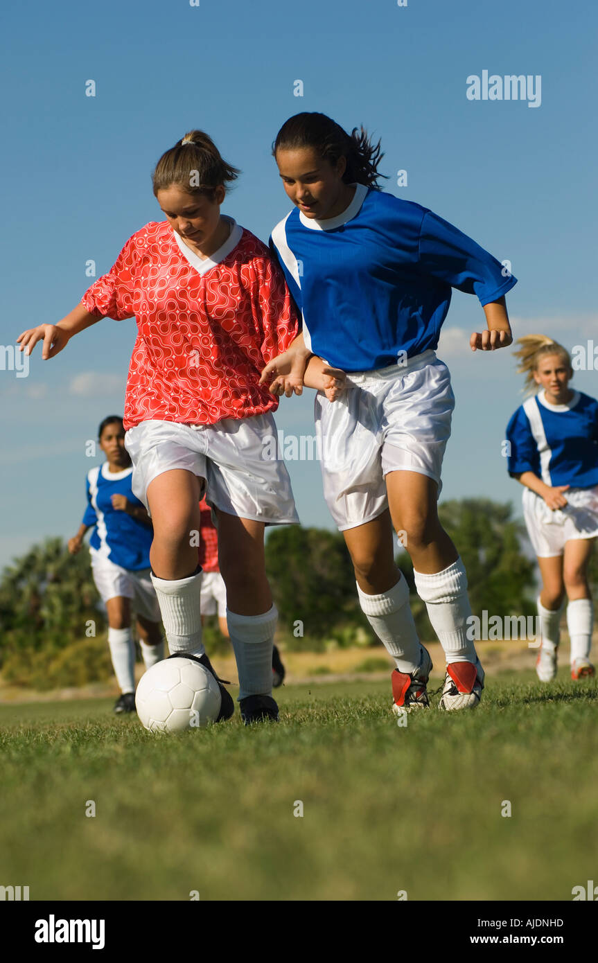 Girl dribbling soccer ball hires stock photography and images Alamy