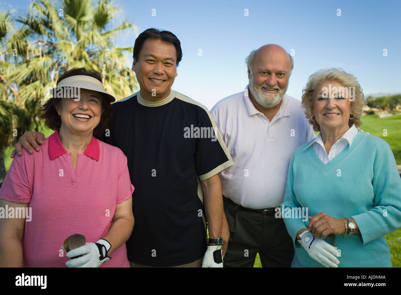 Group senior golfers on golf course, (portrait) Stock Photo