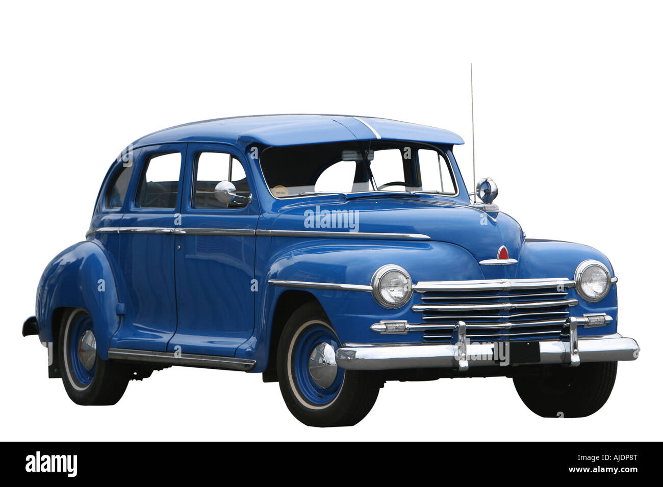 photograph of an old classic car in mint condition shining chrome and