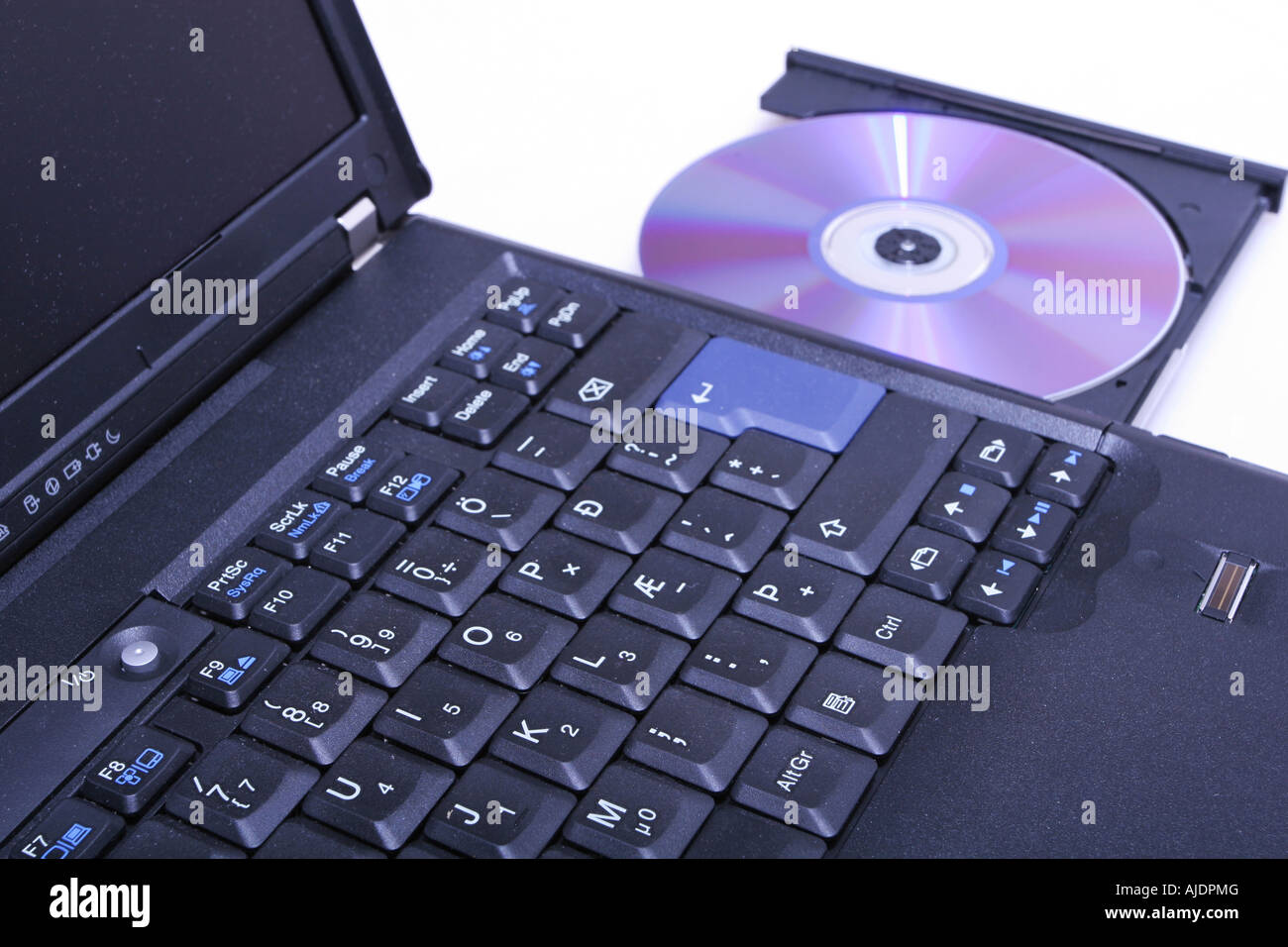 brand new laptop with cd in open cd drive shot on white Stock Photo - Alamy