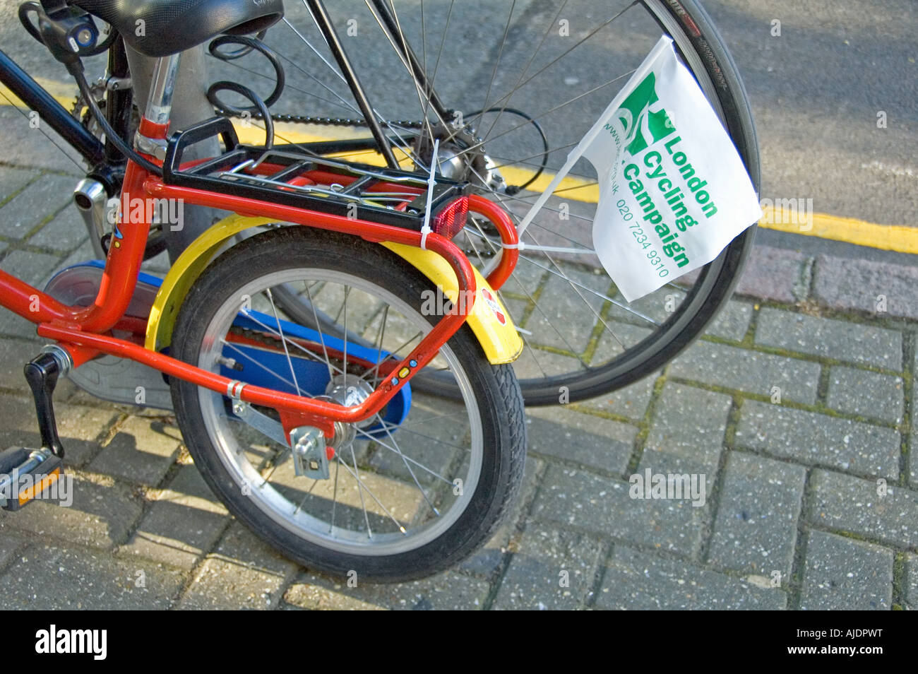 Child s and adult s bike with London Cycling Campaign pennant Stock Photo