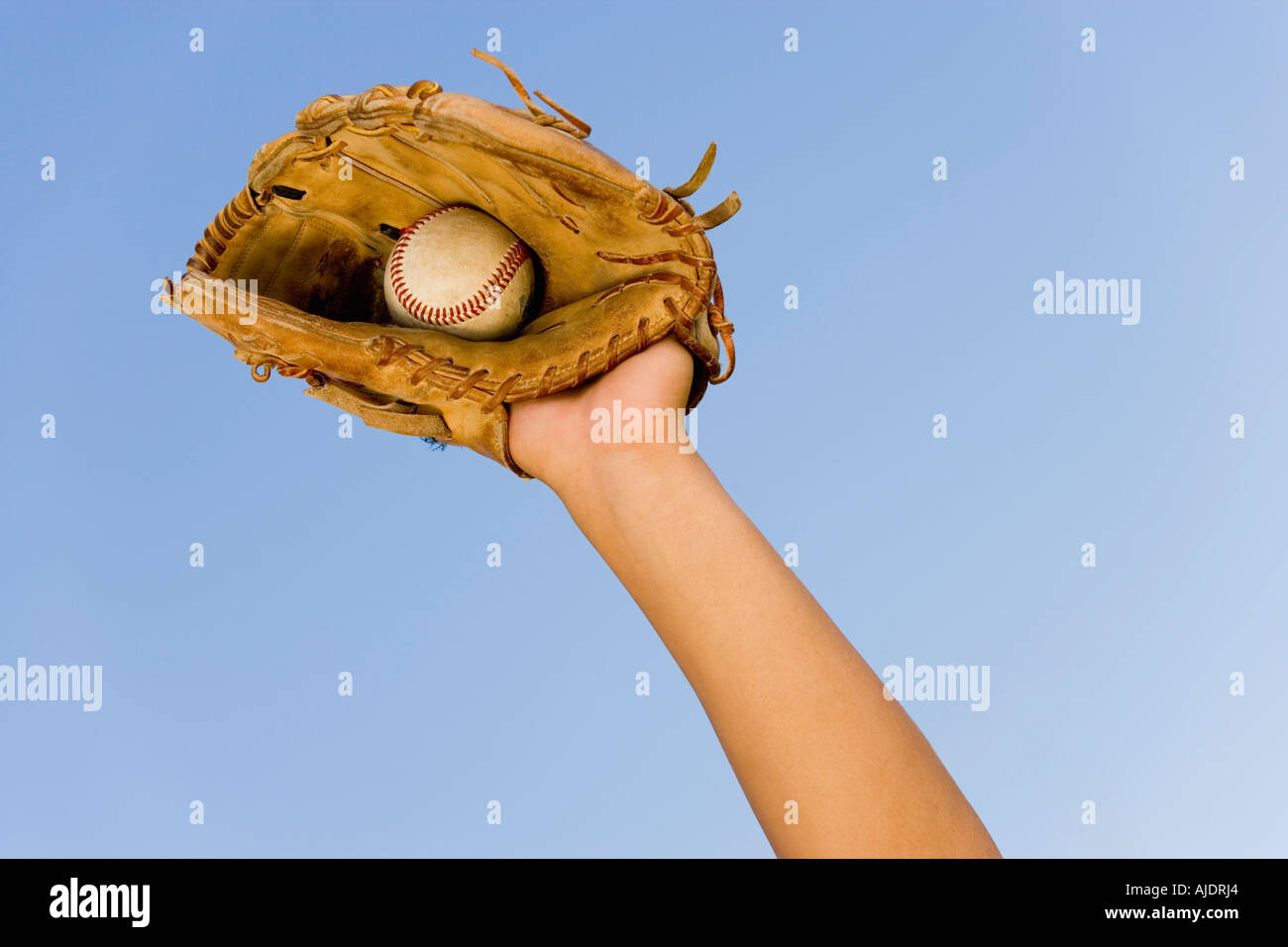 Baseball player catching ball in baseball glove, close-up of hand in Stock  Photo - Alamy