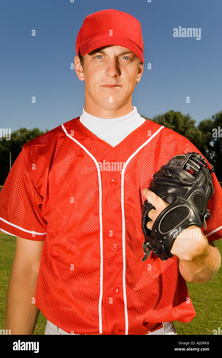 Baseball pitcher holding glove, (portrait Stock Photo Alamy