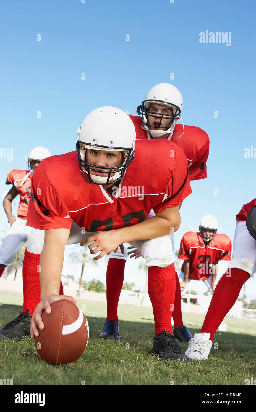 Centre quarterback ready hike football hires stock photography and