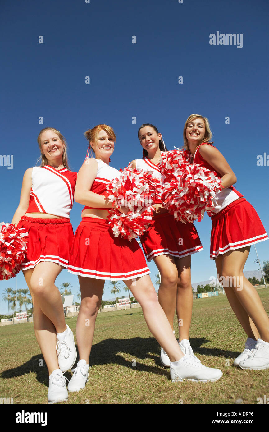 Premium Photo  Cheerleader pom poms backs and students in cheerleading  uniform on a outdoor field athlete group college sport collaboration and  game cheer prep ready for cheering stunts and fan applause