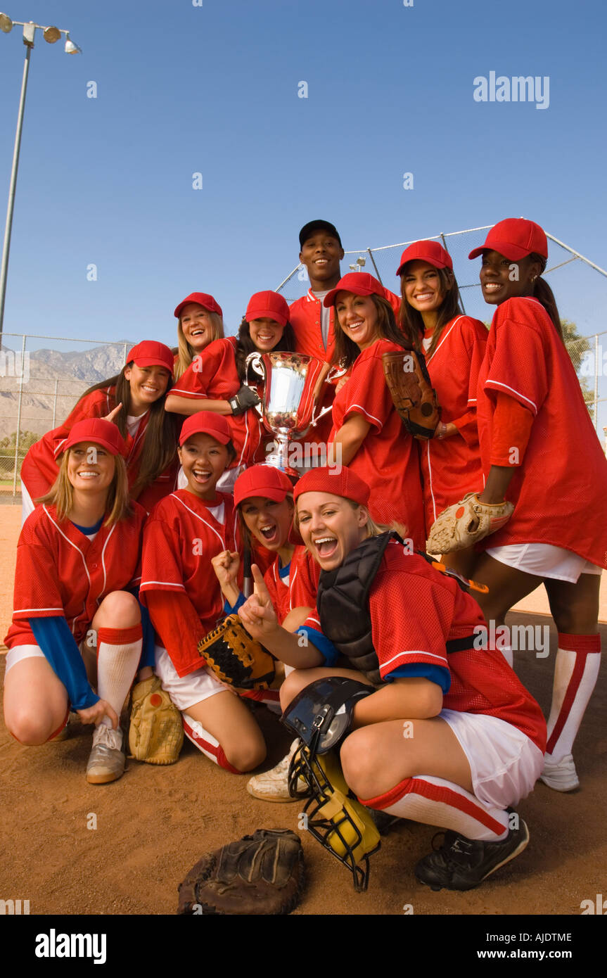 Women's softball team with trophy, portrait Stock Photo