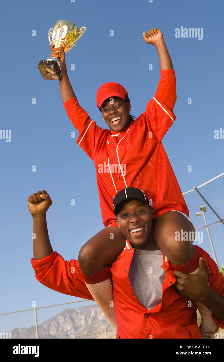 Coach and softball player celebrating Stock Photo - Alamy