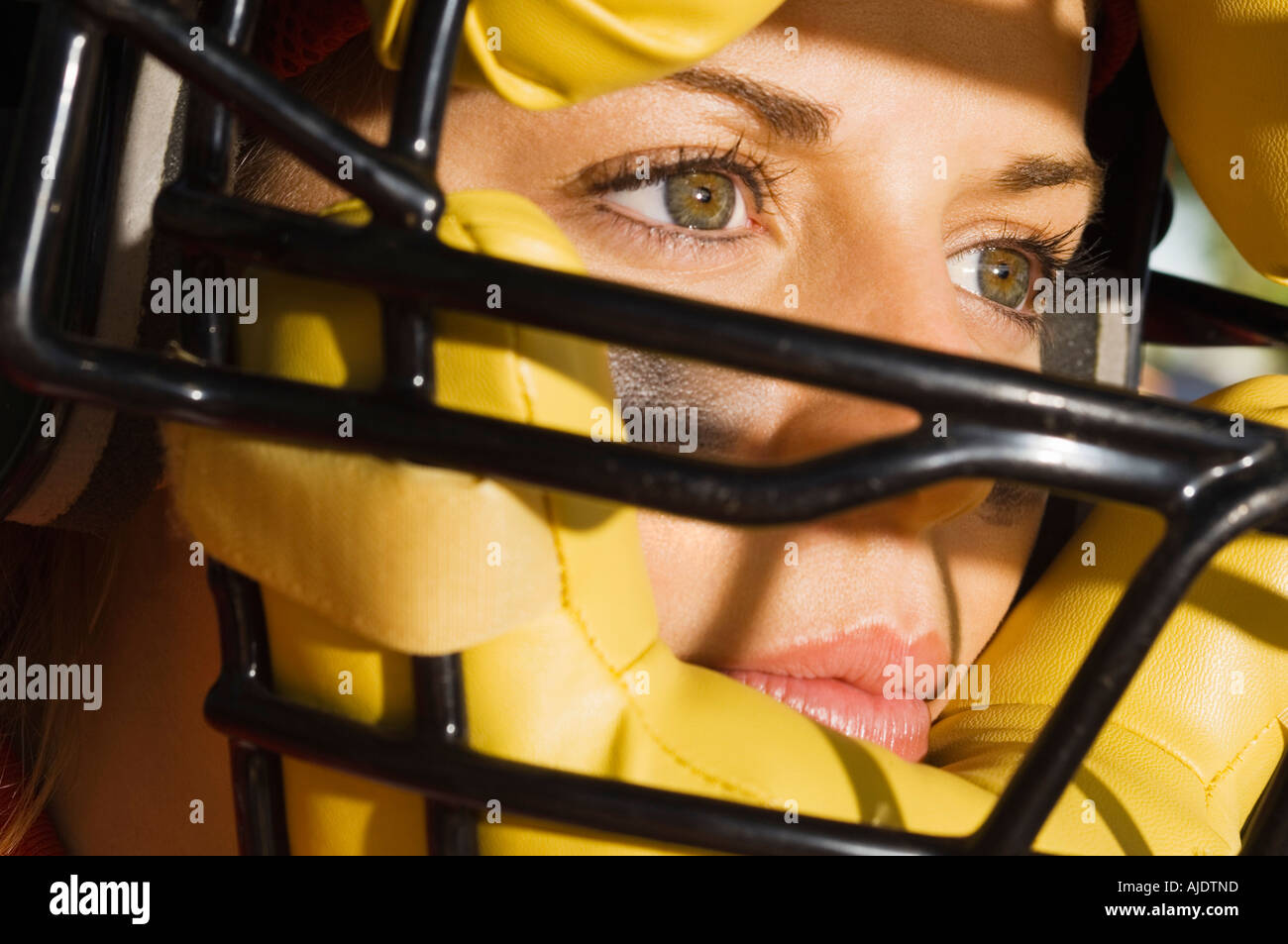 Softball player wearing helmet, closeup of face Stock Photo Alamy