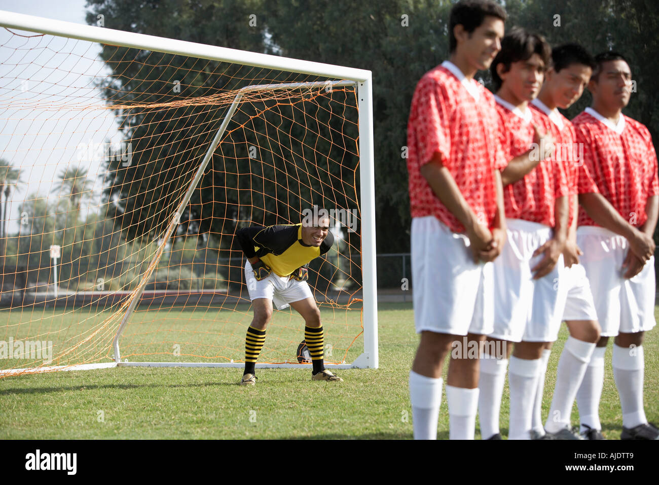 Soccer players preparing for free kick Stock Photo