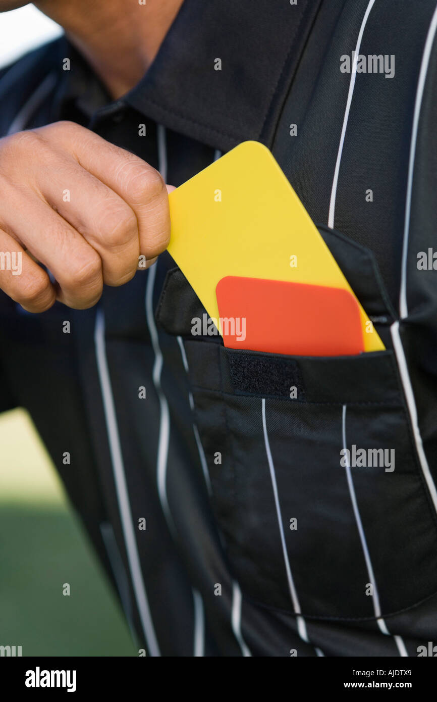 Referee Pockets Referee taking card from pocket, mid section Stock Photo - Alamy
