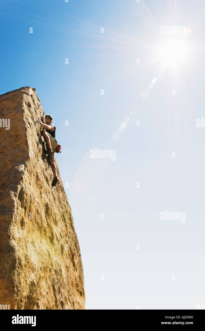 Woman Free Climbing on Cliff Stock Photo Alamy