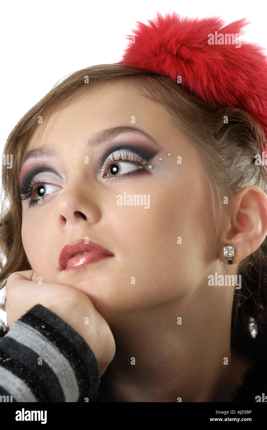 Young beautiful romantic lady with artistic creative make up and a thoughtful expressive look Stock Photo