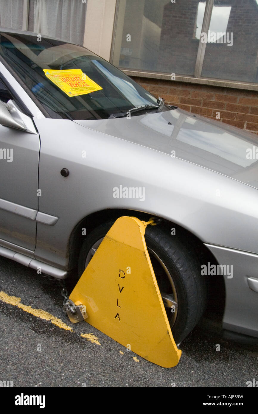 Car, wheel clamp, government agencies, untaxed, Denver Boot, yellow metal clamp, vehicle