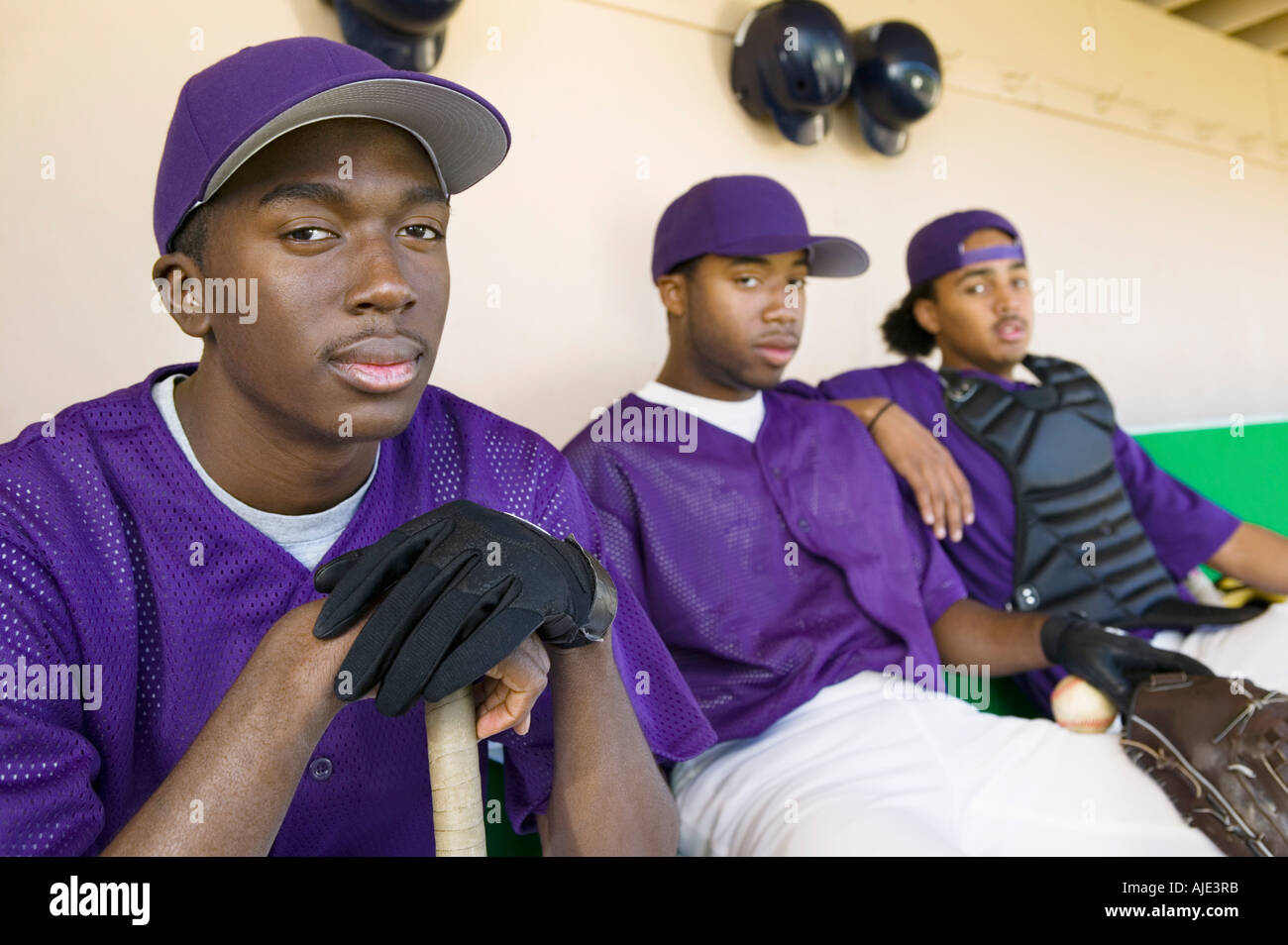 Baseball players sitting in dugout, (portrait Stock Photo Alamy