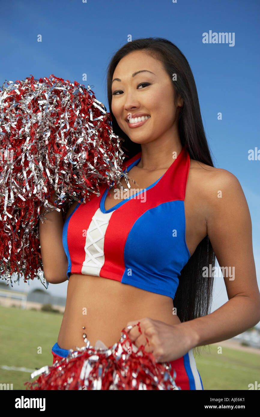 Cheerleader with pom poms Stock Photo Alamy