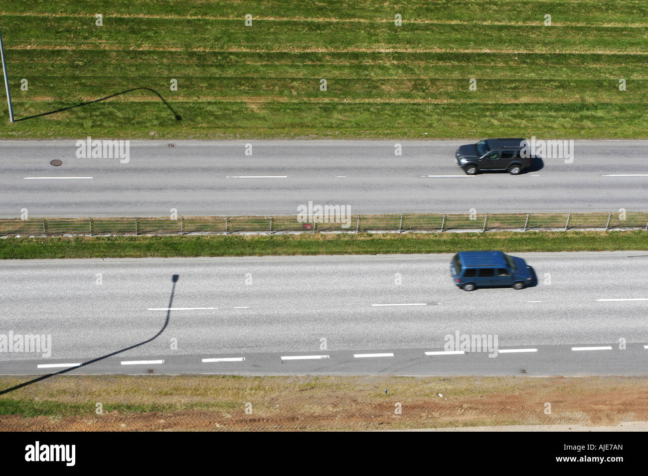 two cars traveling in opposite direction shot from above Stock Photo