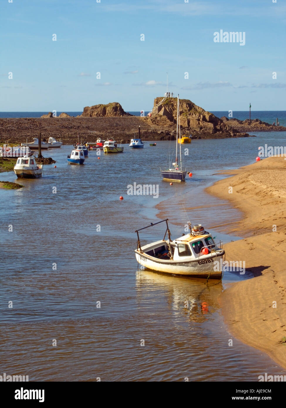 Fishing Boats at low water, Bude Harbour, Chapel Rock, and Breakwater, Budehaven, Bude, Atlantic Heritage Coast, Cornwall England, United Kingdom Stock Photo