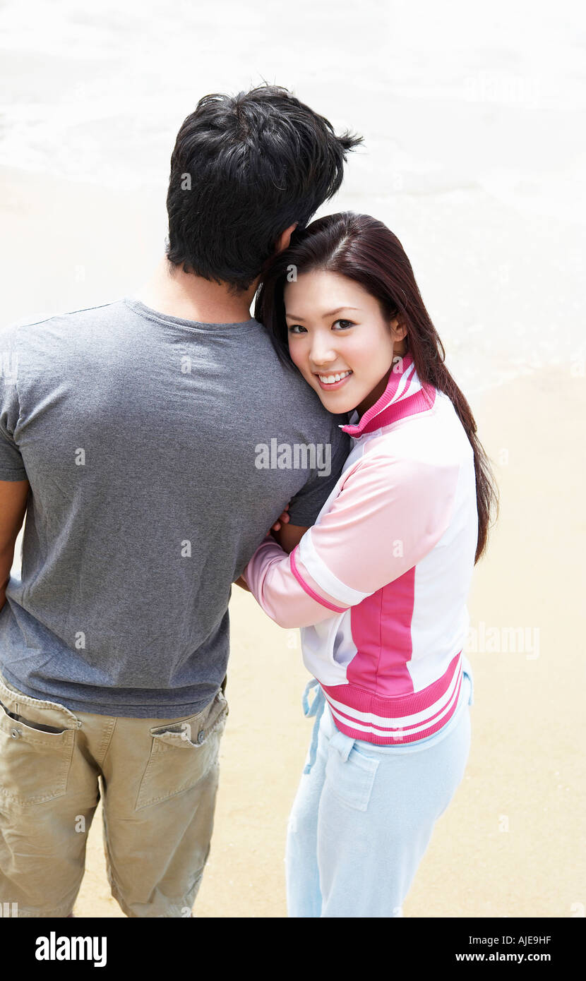 Young Couple Arm In Arm On Beach Elevated View Stock Photo Alamy