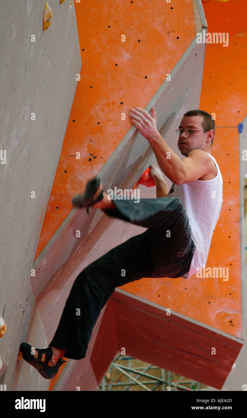 Male competing in a Bouldering climbing competition in Edinburgh 2003