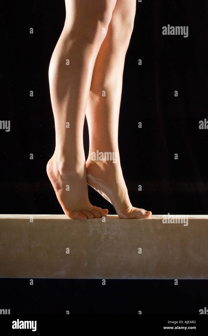 Gymnast (1315) on balance beam, low section Stock Photo Alamy