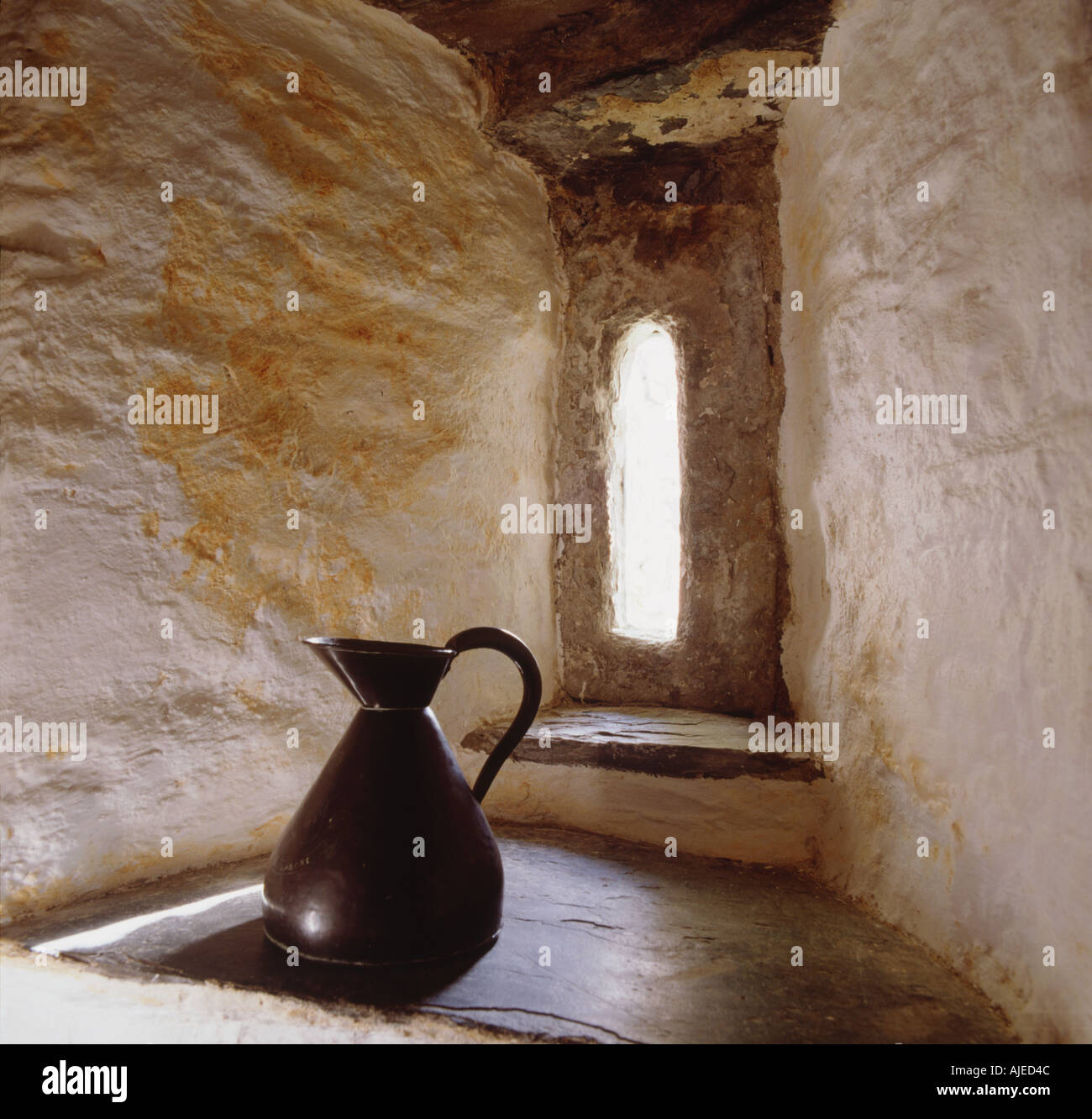 Close up of a tiny window in the Old Post Office at Tintagel Cornwall ...