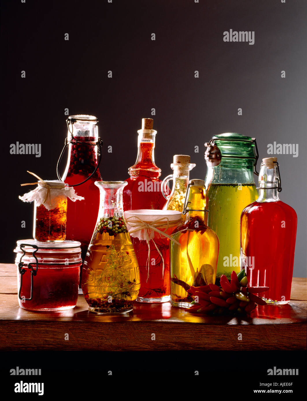 A colourful collection of bottles and jars containing various home made