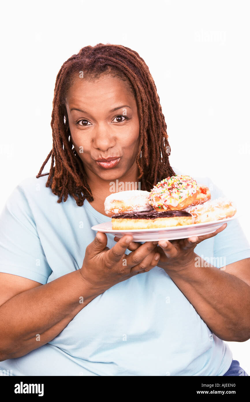 Overweight Woman Holding Junk Food Portrait Stock Photo Alamy overweight-woman-holding-junk-food-portrait-stock-photo-alamy