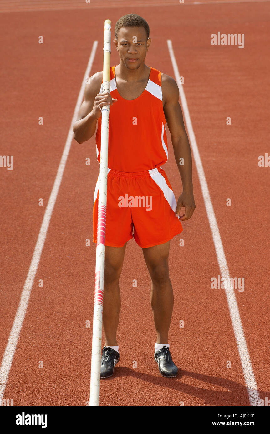 Male athlete with pole vault on running track Stock Photo Alamy