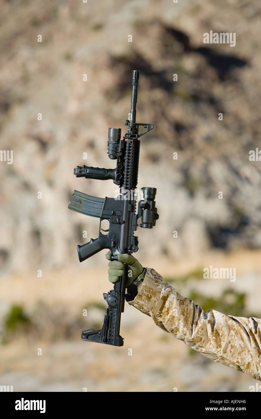 Person holding rifle, outdoors Stock Photo - Alamy