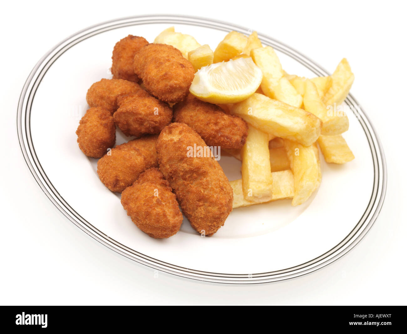 Plate Of Deep Fried Traditional British Scampi and Chips Against A