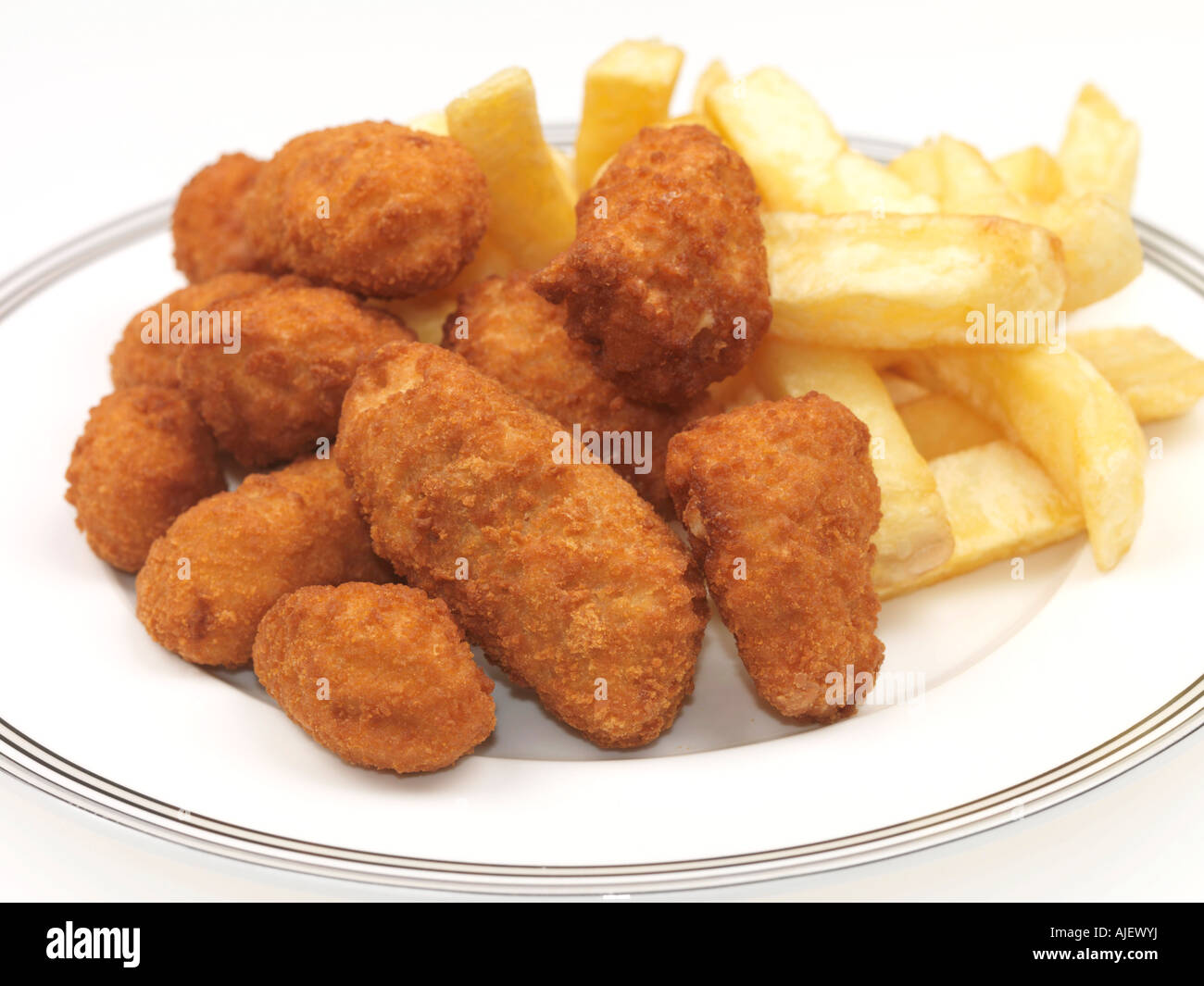 Plate Of Deep Fried Traditional British Scampi and Chips Against A