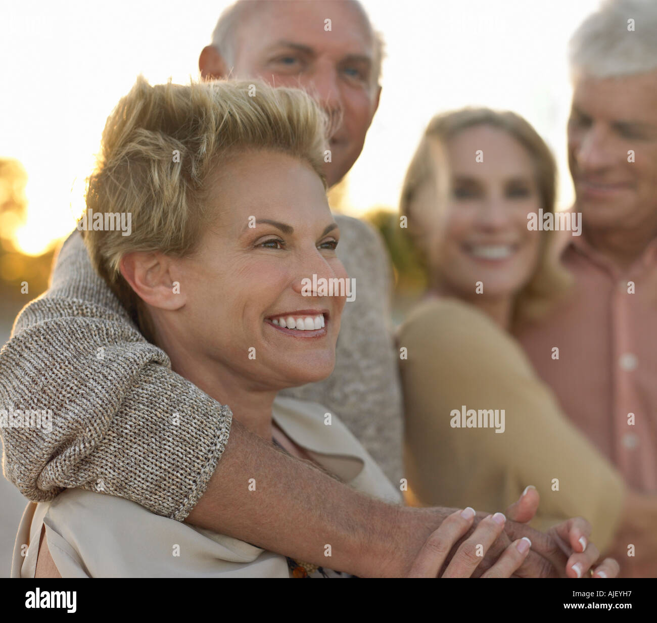Senior couples relaxing together on beach Stock Photo - Alamy
