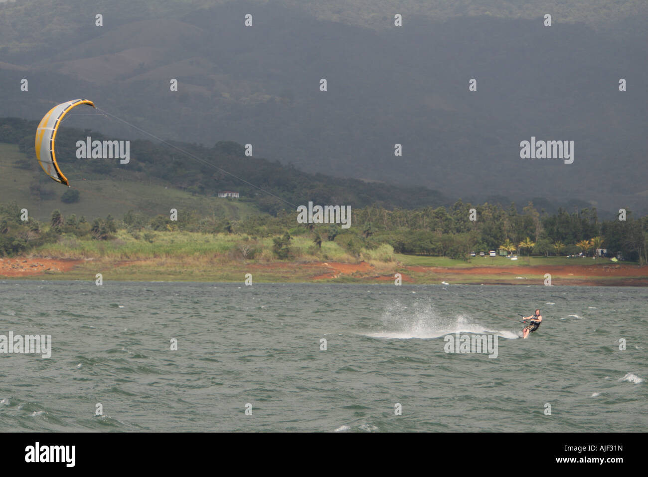 Kite boarding in Costa Rica lake Arenal Stock Photo Alamy