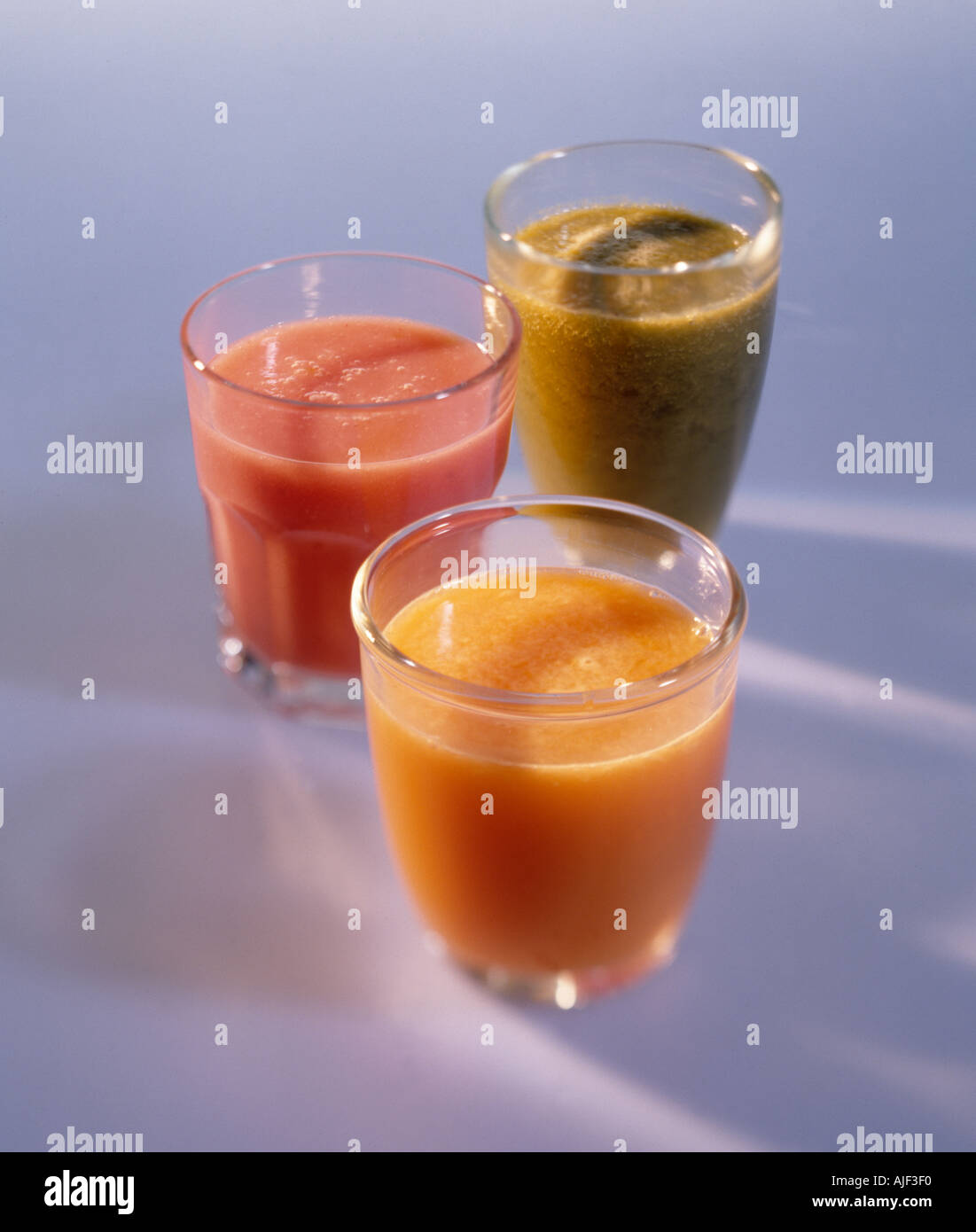 Spinach strawberry and carrot juice drinks Stock Photo Alamy