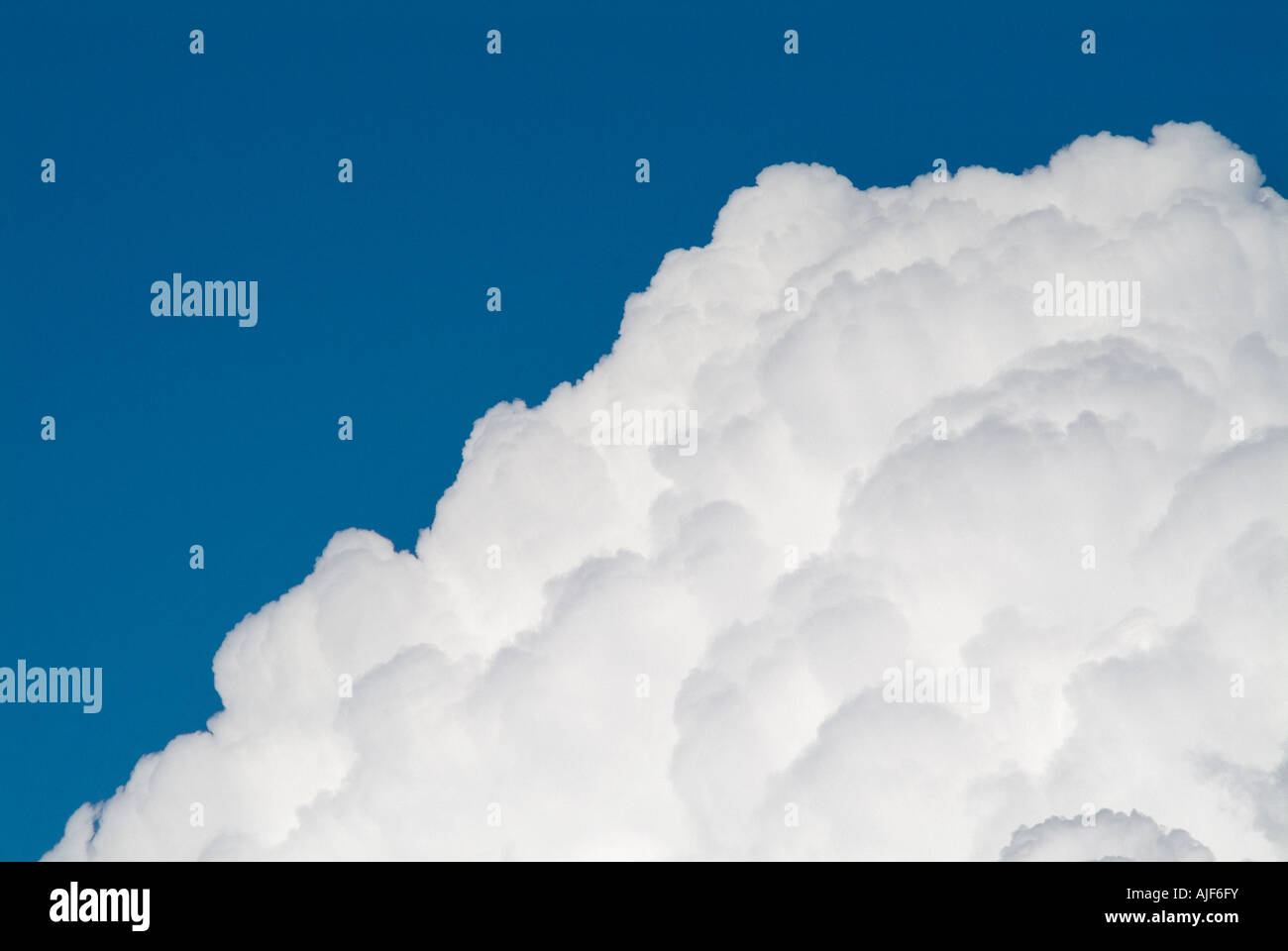 Cumulus clouds against a blue sky Stock Photo