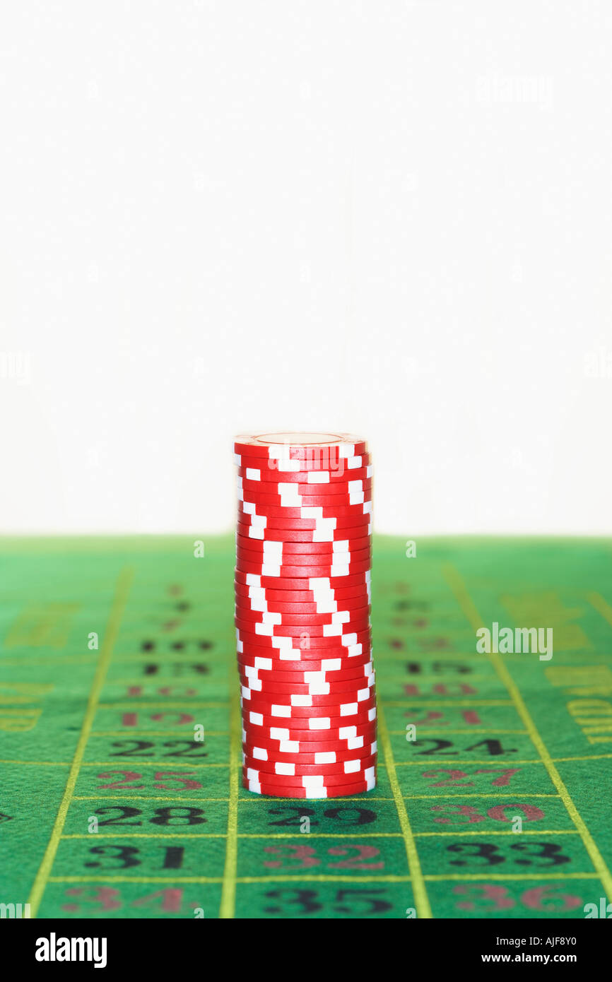 Stack of gambling chips on roulette table Stock Photo
