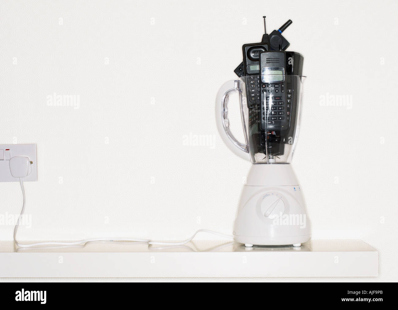 Mobile phones in electric blender Stock Photo Alamy