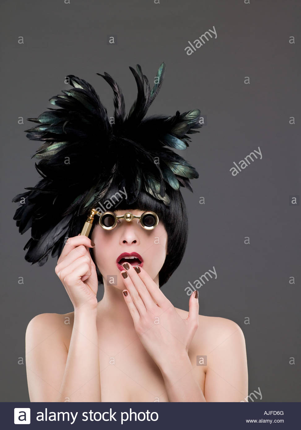 Woman looking through opera glasses Stock Photo 14721687 Alamy