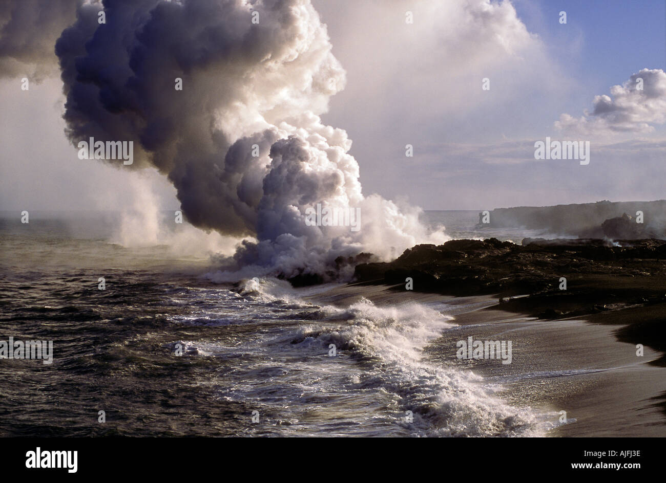 Hawaii's Kilauea Volcano Flowing into the Pacific Stock Photo
