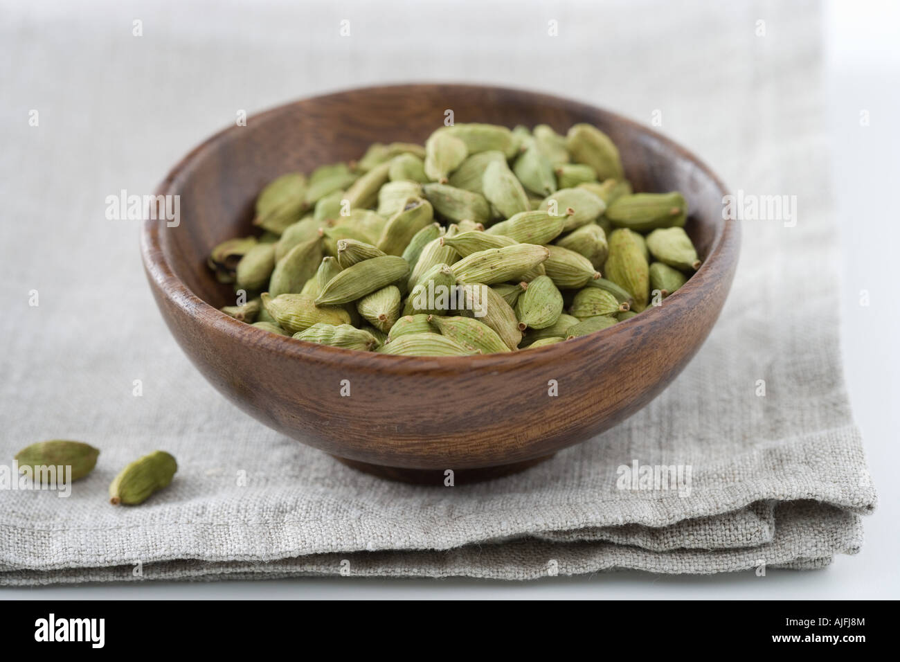 Cardamom seeds in a bowl Stock Photo