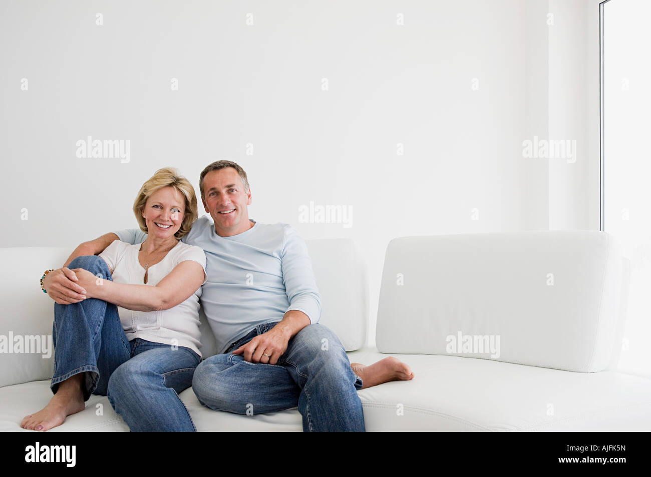 Older woman relaxing on sofa hi-res stock photography and images - Alamy