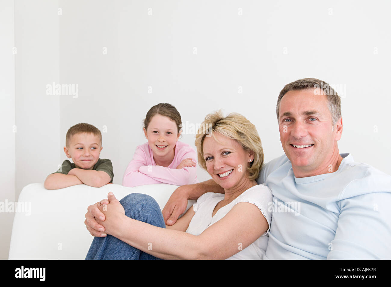 Family on a sofa Stock Photo Alamy