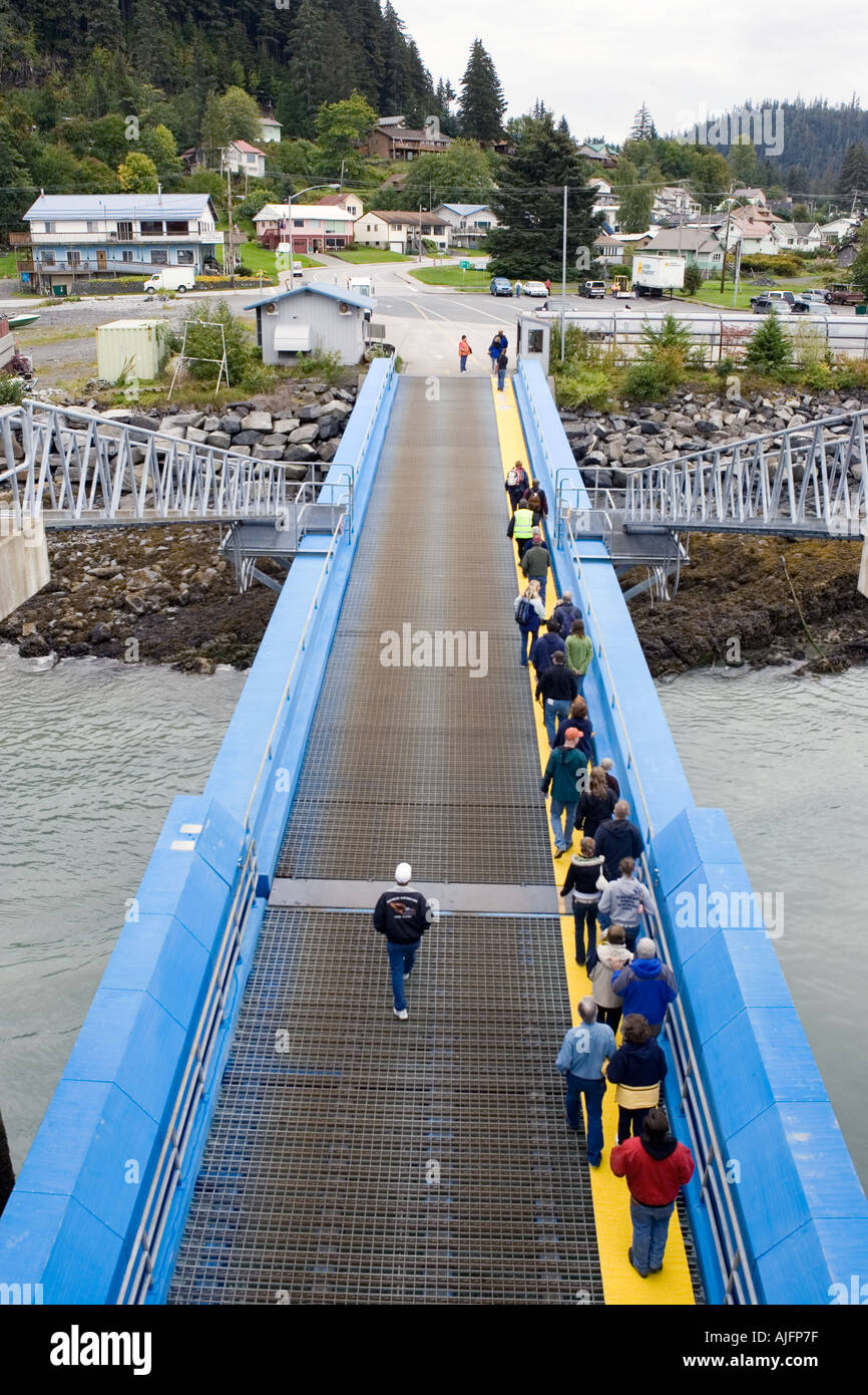 Passengers disembark from a ship from the Alaska Marine Highway Ferry System in Wrangell in the Inside Passage between Sitka and Stock Photo