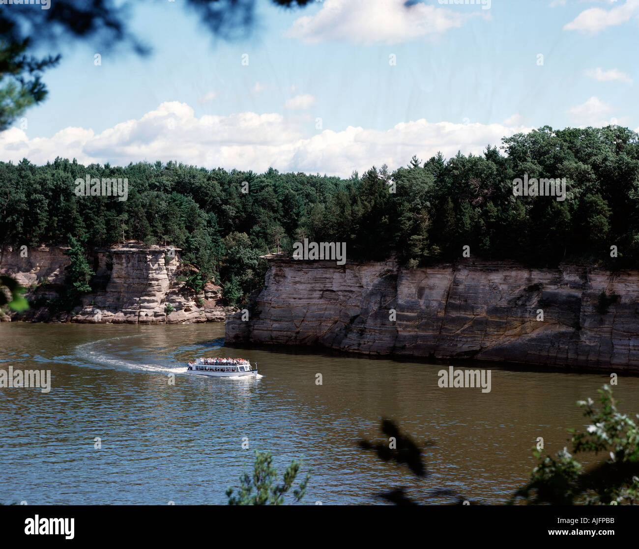 Tour boat takes tourists for a view of the Wisconsin Dells Stock Photo